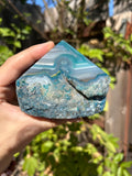 Dyed blue/teal agate half polished