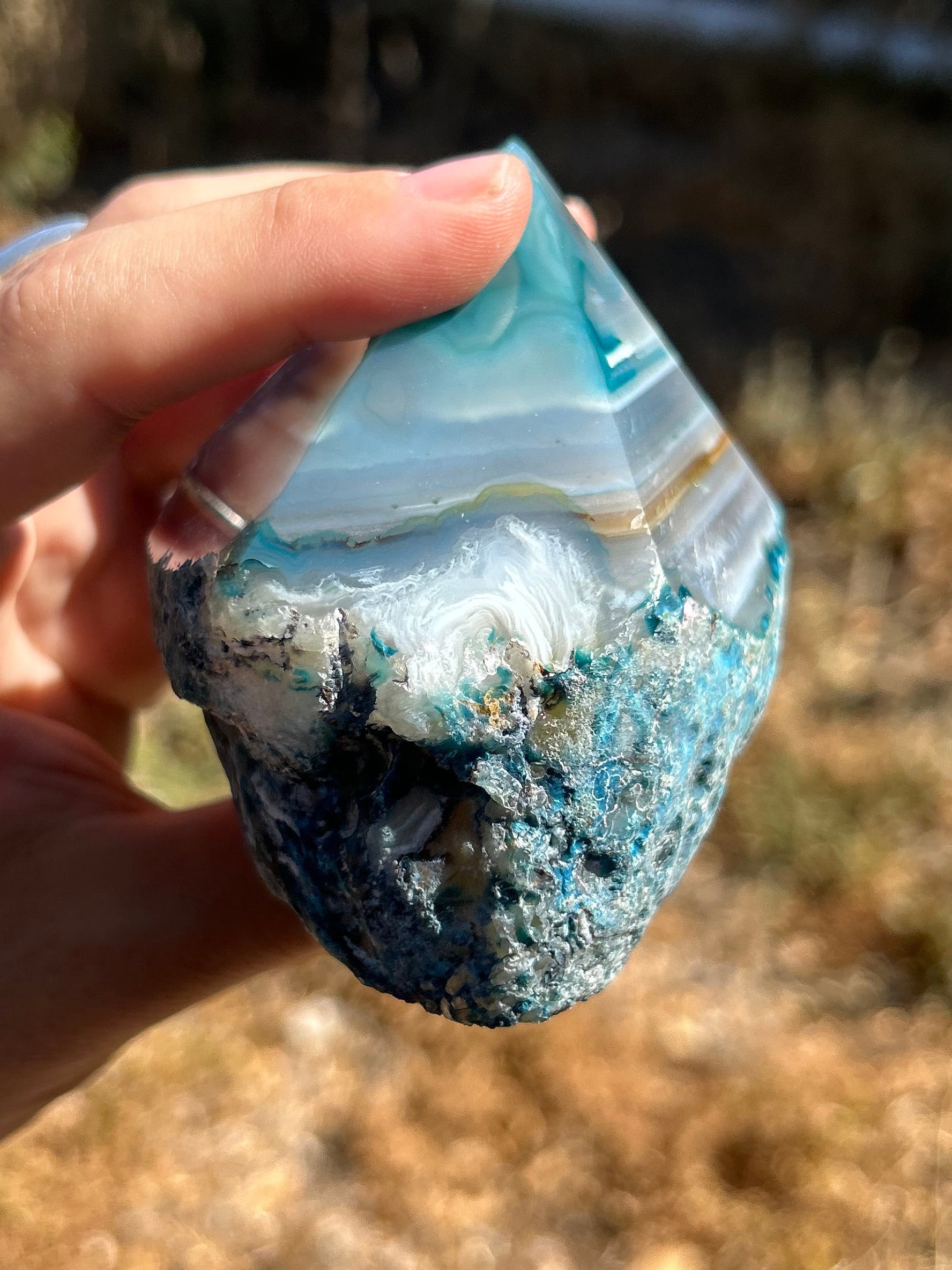 Dyed blue/teal agate half polished