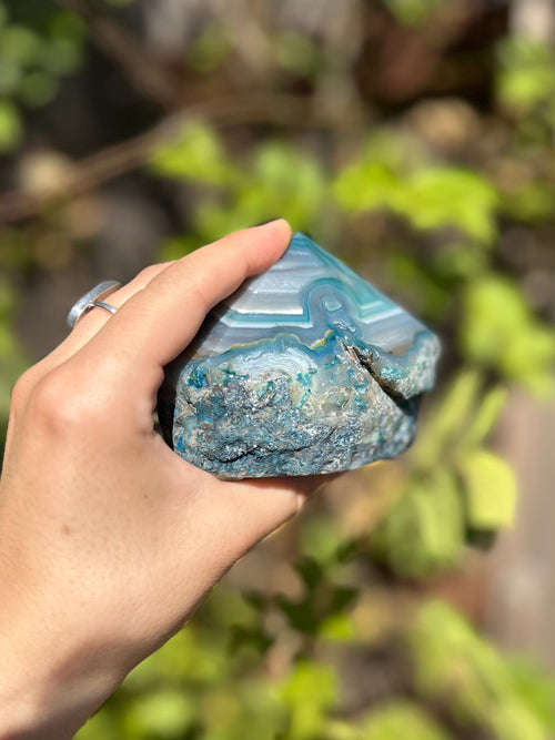 Dyed blue/teal agate half polished
